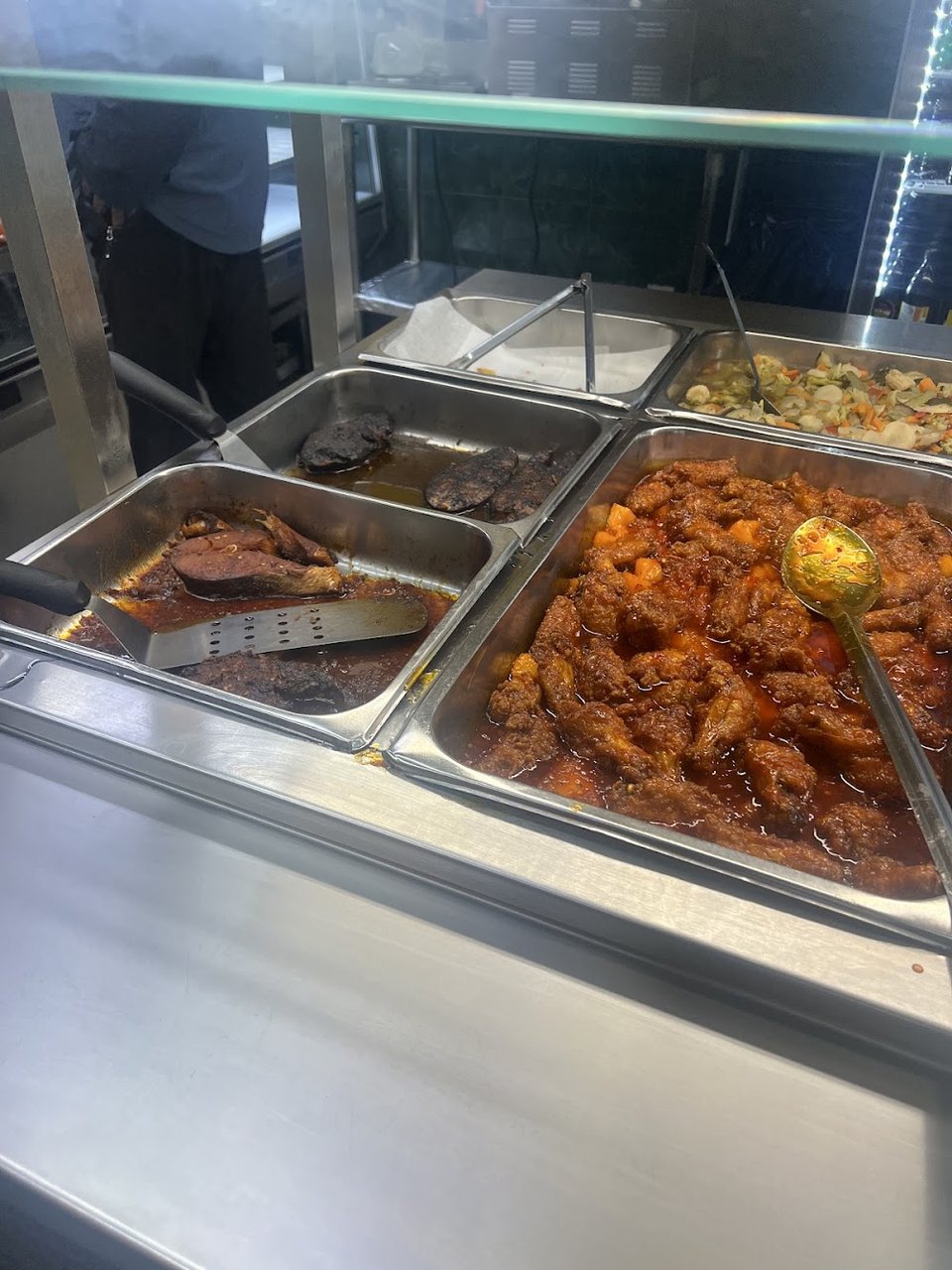 Printed menu with Caribbean breakfast and combo plates.