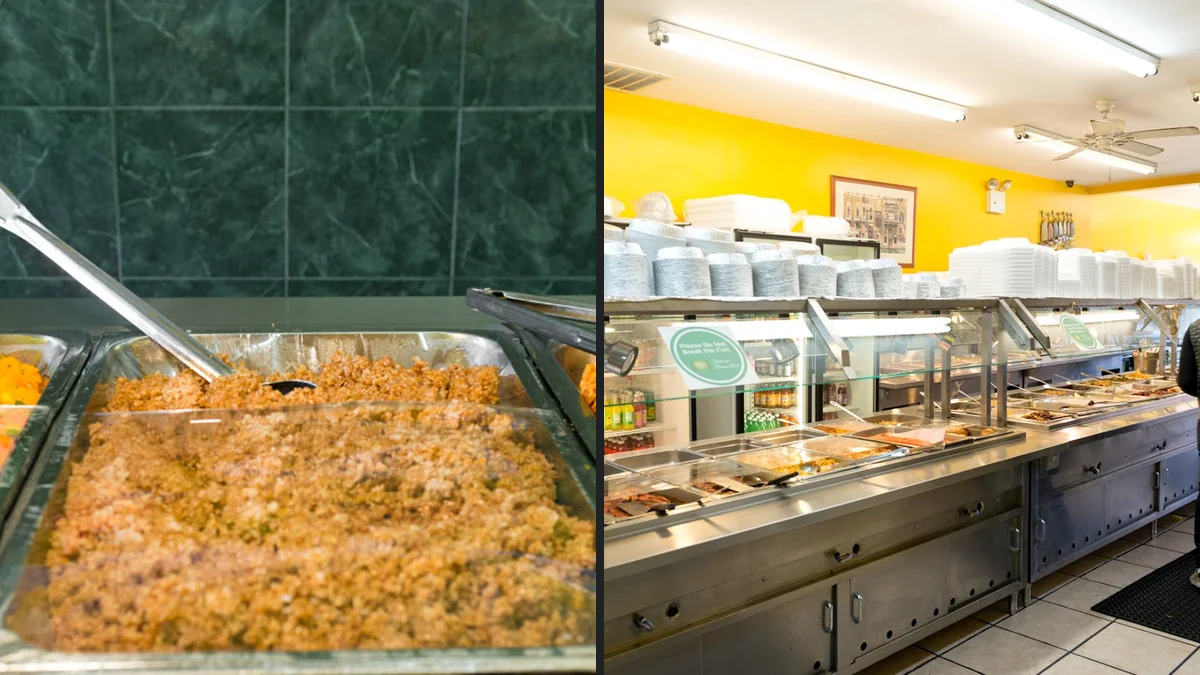 Caribbean restaurant counter with buffet-style dishes.